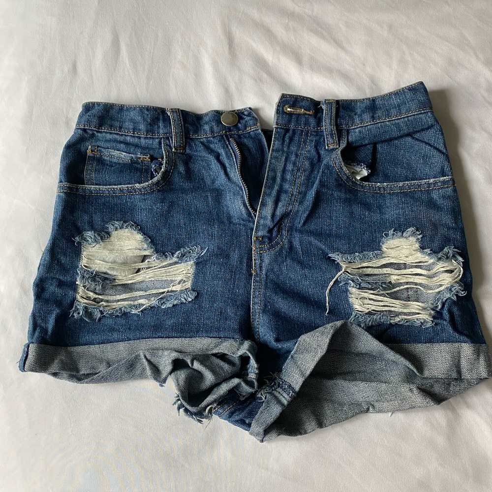 Ripped blue Jean shorts